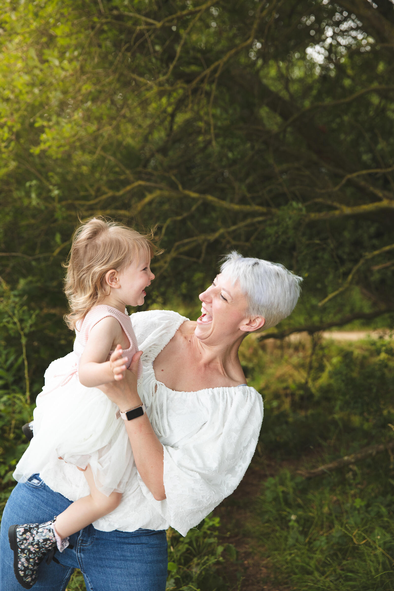 mum holding her little girl during a family photo session in Lincoln